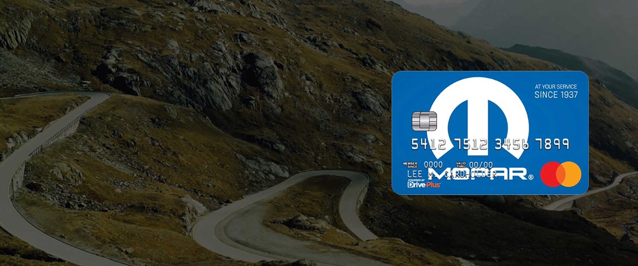 Mopar-branded Mastercard superimposed on a vista of a winding mountain road.